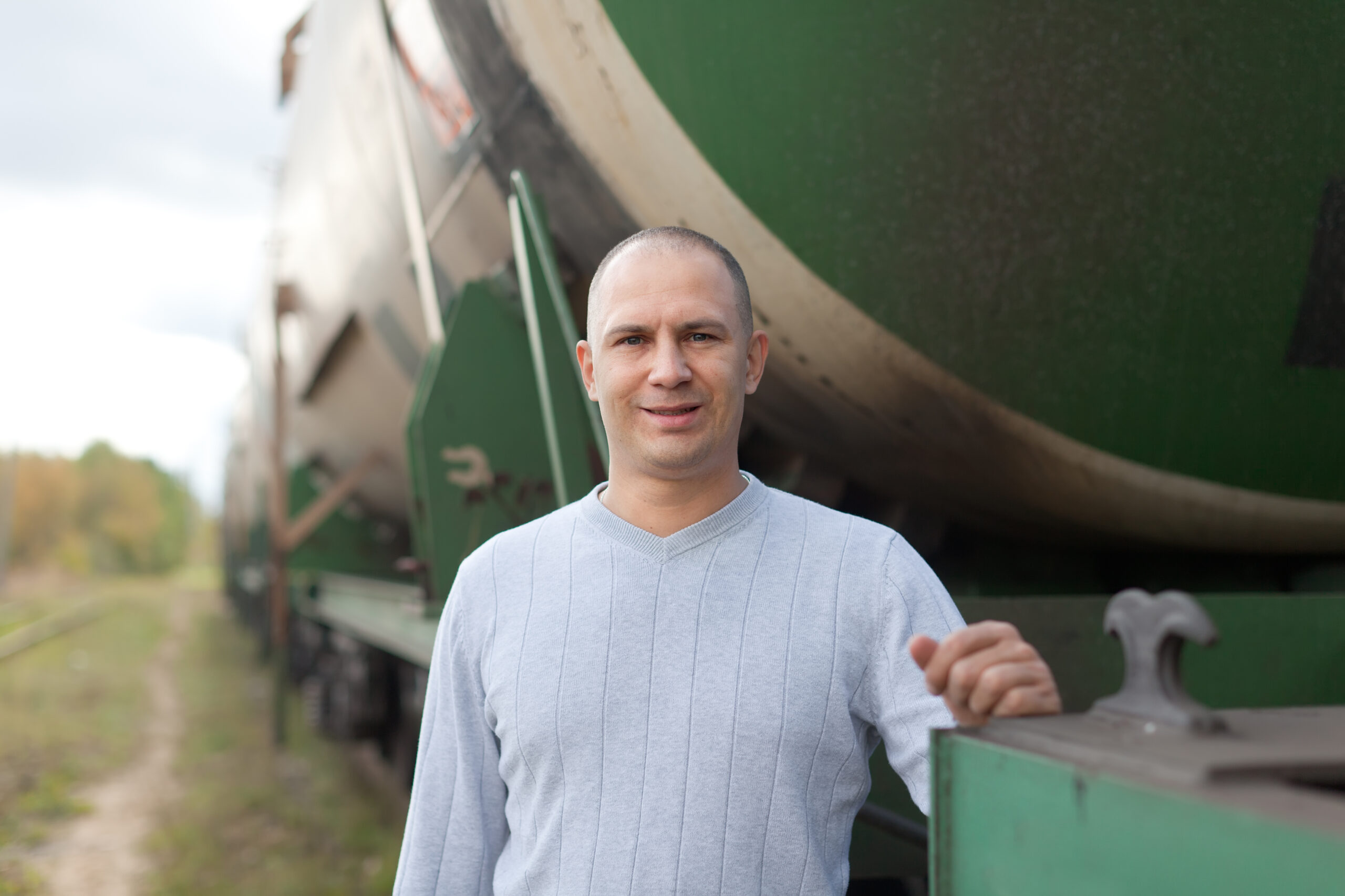 worker near cistern car worker near cistern car at railway